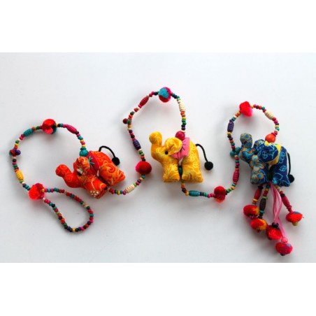 Hanging decoration made of three fabric elephants and wooden beads.