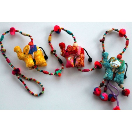 Hanging decoration made of three fabric elephants and wooden beads.